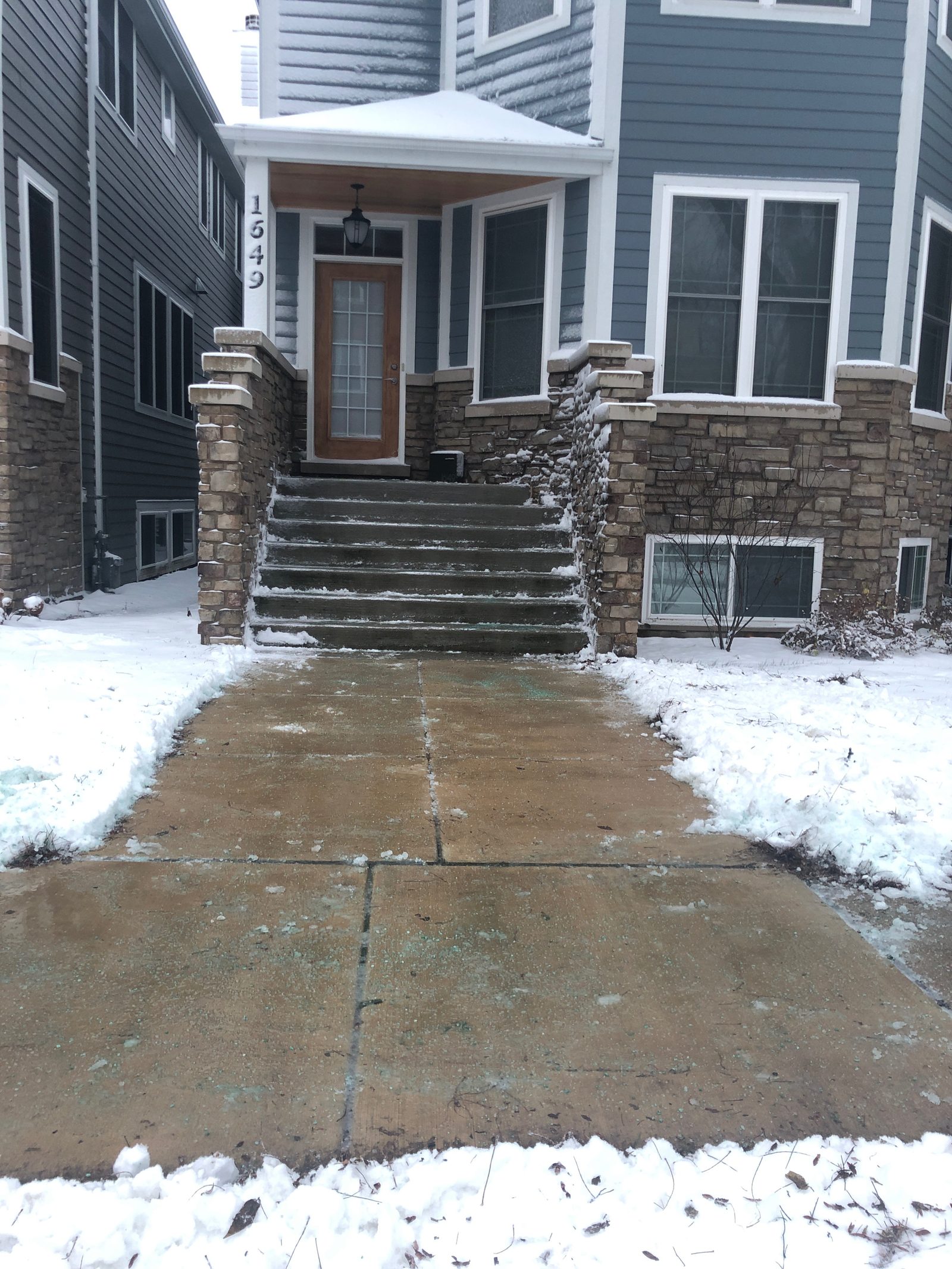 Snow Pushers cleared walkway on a Chicago residential property in winter